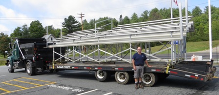 bleachers being transported on a lowbed trailer