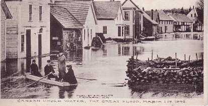 historic photo of men in boat in floodwaters downtown