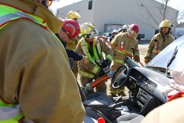 fire fighters learning car extraction techniques