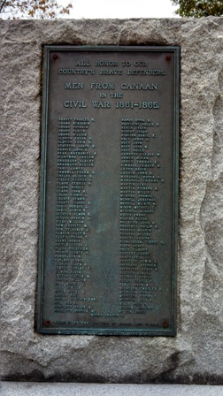 memorial stone set with bronze plaques of veteran names