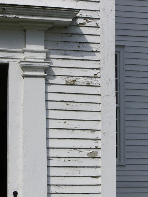 peeling paint near meeting house entrance