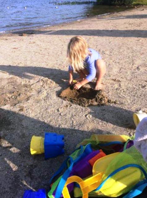 child playing in sand