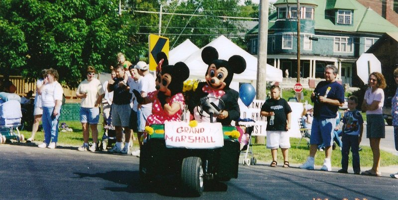 Minnie and Mickey Mouse on a 5-wheeler