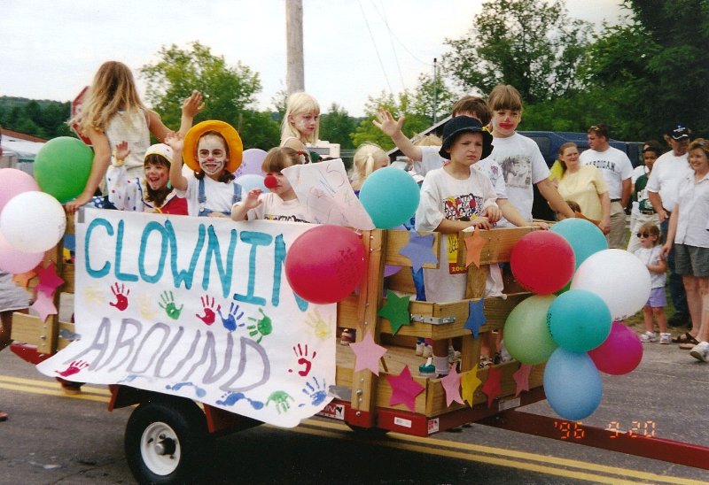 cart full of children dressed as clowns