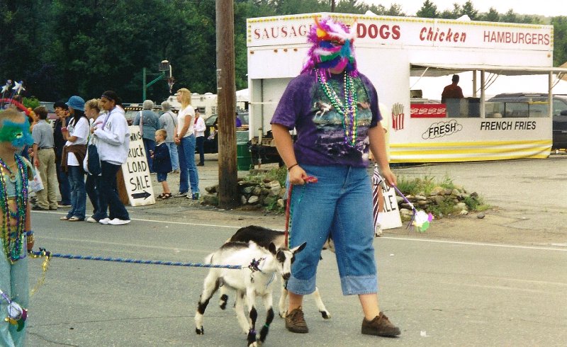 mardi gras costumed woman and goat
