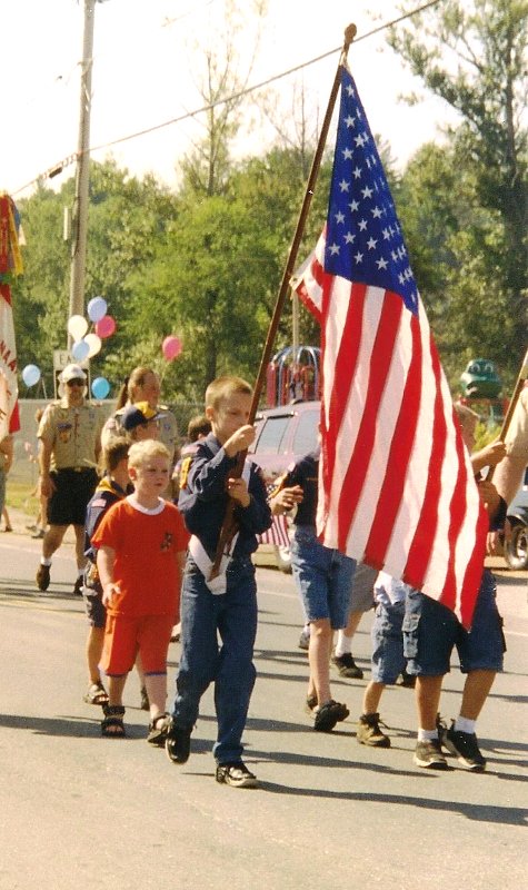 boyscout carrying flag