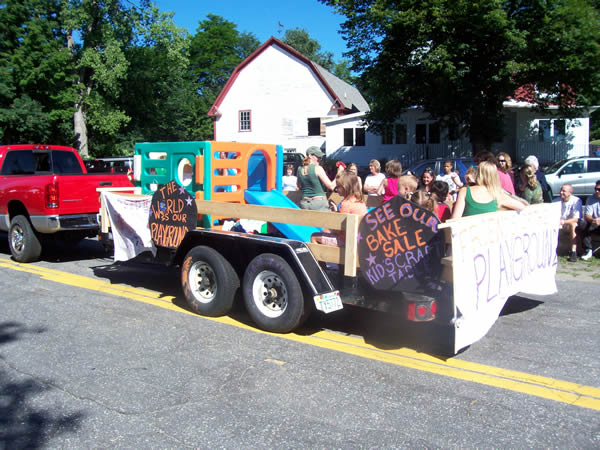 parade float featuring playground fund drive