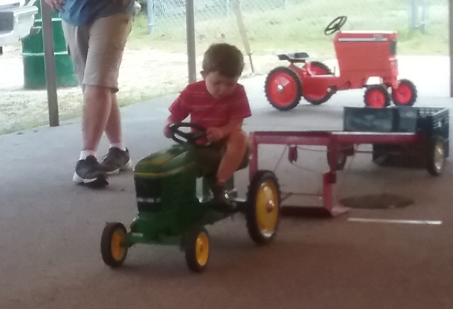 child in tractor pull