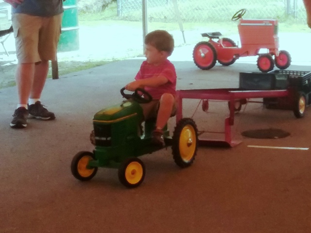 child in tractor pull